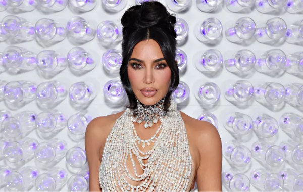 Kim Kardashian Embraces Her Inner Barbie: Stunning Beach Look and White Party Glam