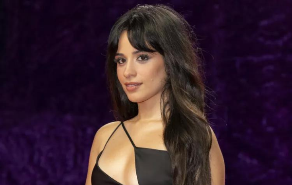 Celebrities have been taking sides, embracing their inner Barbie doll with pink thigh-high boots and tweedy blazer dresses. However, Camila Cabello surprised everyone by boarding the Oppenheimer train.
