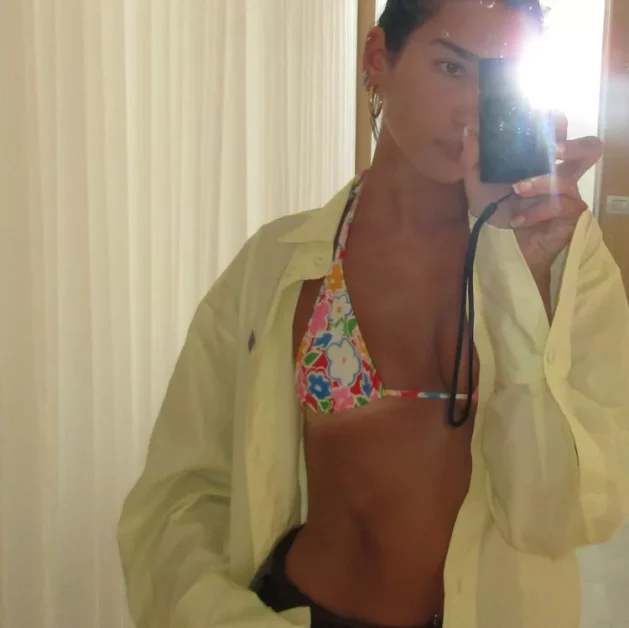 Summer's Signature Shade: Dua Lipa Stuns In Creamsicle Bikini