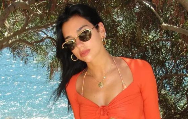 Summer's Signature Shade: Dua Lipa Stuns in Creamsicle Bikini