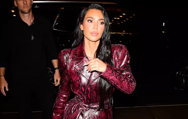 Kim Kardashian Proves the Versatility of Animal Print with Her Cherry Red Snakeskin Trench Coat