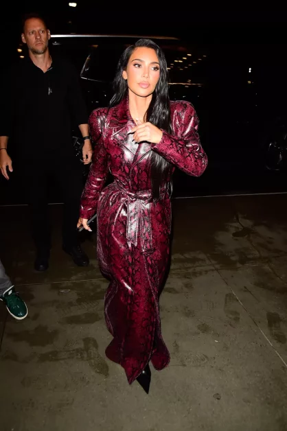 Kim Kardashian Proves the Versatility of Animal Print with Her Cherry Red Snakeskin Trench Coat